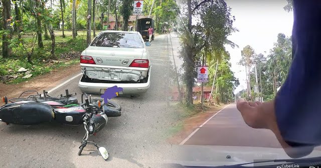 සර්පයෙකු බේරාගන්න ගිහින් පිටුපසින් පැමිණි යතුරුපැදිකරු, කාරයේ වහලය උඩින් බැස්ස හැටි..!